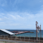 Suma Fishing Park in Kobe, a perfect spot for international tourists to enjoy sea fishing for Horse Mackerel and Sea Bream on a beautiful red pier.