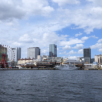 A panoramic view of Kobe Harborland across the harbor from Meriken Park featuring MOSAIC and umie